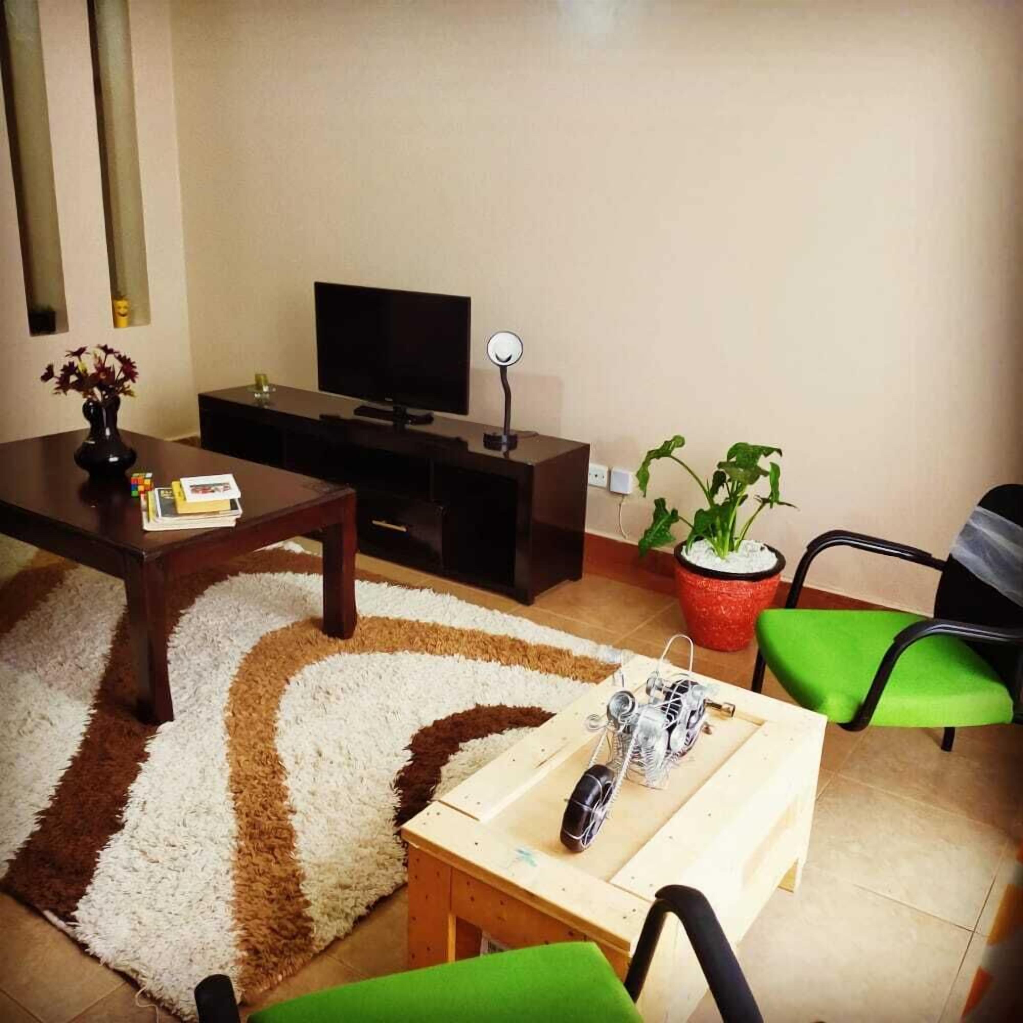 Comfort Apartment | Living area | 14-inch Smart TV with digital channels, TV