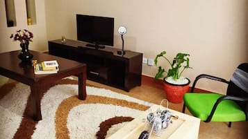 Comfort Apartment | Living area | 14-inch Smart TV with digital channels, TV