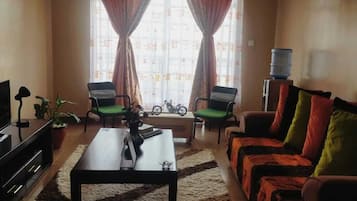 Comfort Apartment | Living area | 14-inch Smart TV with digital channels, TV