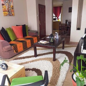 Comfort Apartment | Living area | 14-inch Smart TV with digital channels, TV - Stay.Plus Shaba Village Apartment (Syokimau)