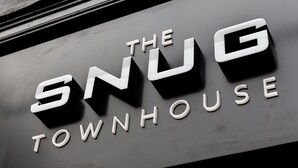 A sign with the words "The Snug Townhouse" in white letters on a dark background. - The Snug Townhouse (Galway)