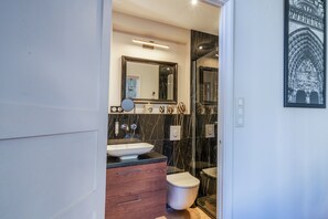 Shower, hair dryer, towels, toilet paper