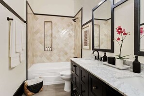 Bathtub, hair dryer, towels, soap