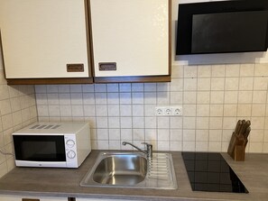 Microwave, coffee/tea maker, cookware/dishes/utensils