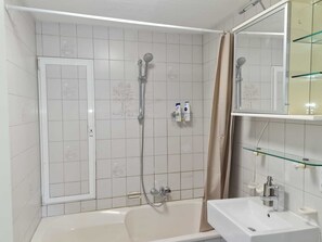 Bathtub, hair dryer, towels