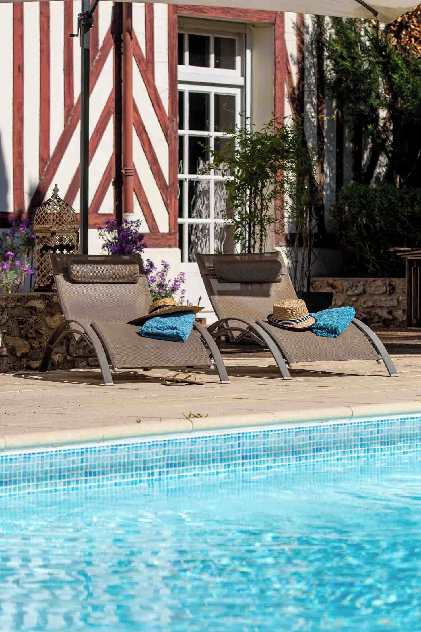 Seasonal outdoor pool, open 9:00 AM to 8:30 PM, pool umbrellas