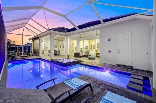 Stunning New Waterfront Luxury Villa with oversized Heated pool and Hot tub!