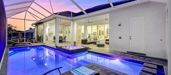 Stunning New Waterfront Luxury Villa with oversized Heated pool and Hot tub!