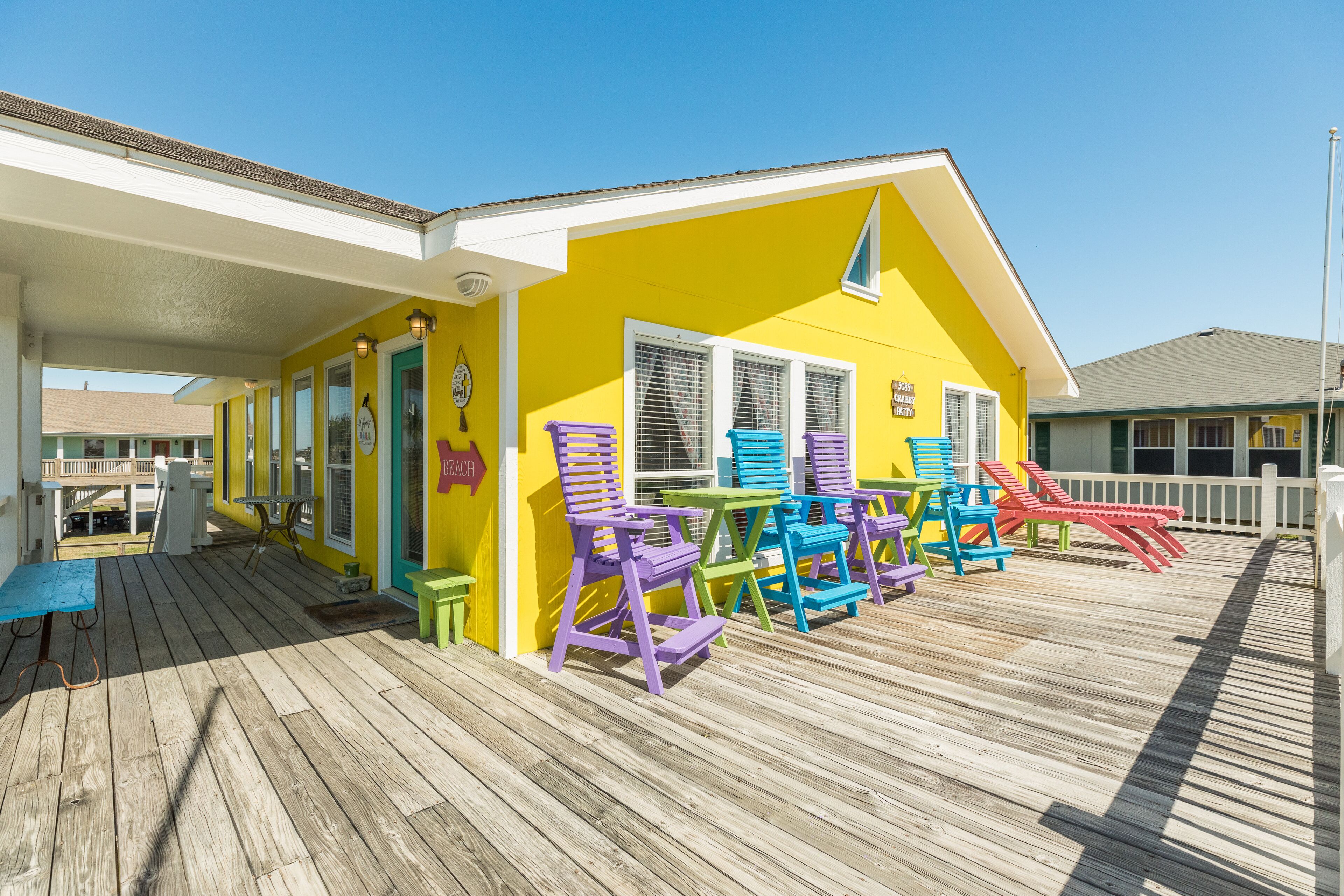 Colorful Gulf view home with wraparound deck and AC - walking distance to beach
