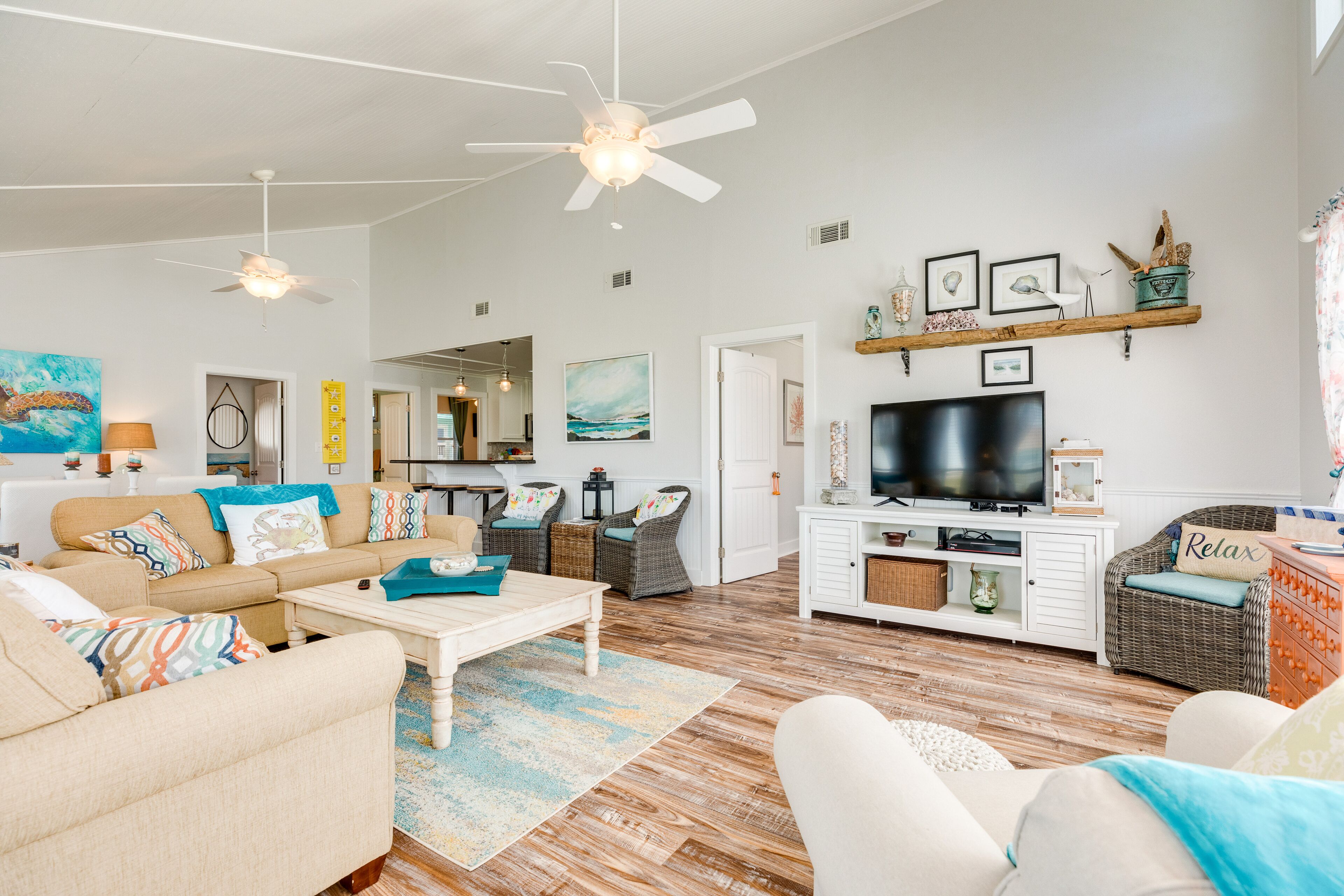 Colorful Gulf view home with wraparound deck and AC - walking distance to beach