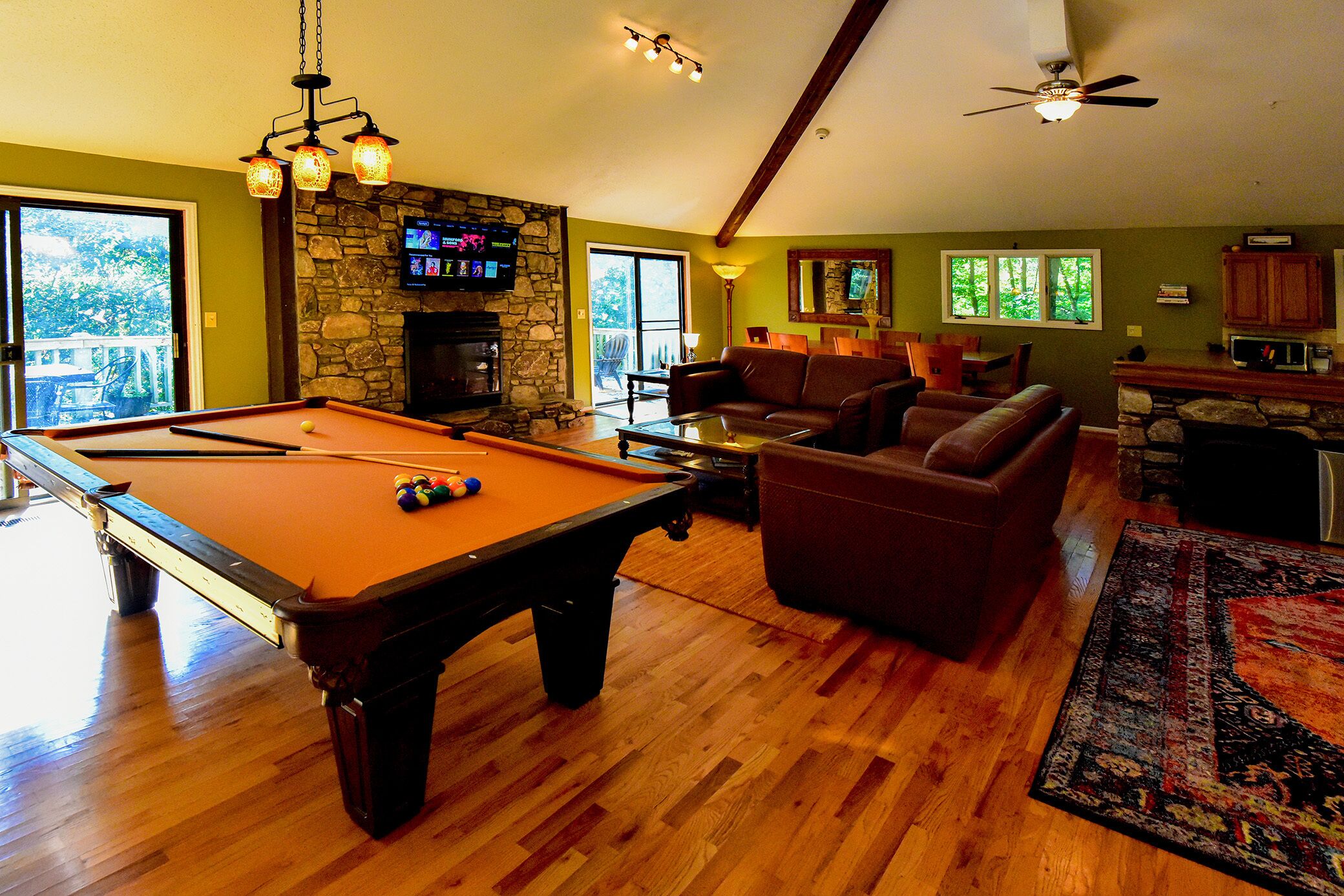 Relax in the Forest - but close to town. Large great room w/ pool table.