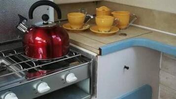 Cabin | Private kitchen | Fridge, stovetop, electric kettle, toaster