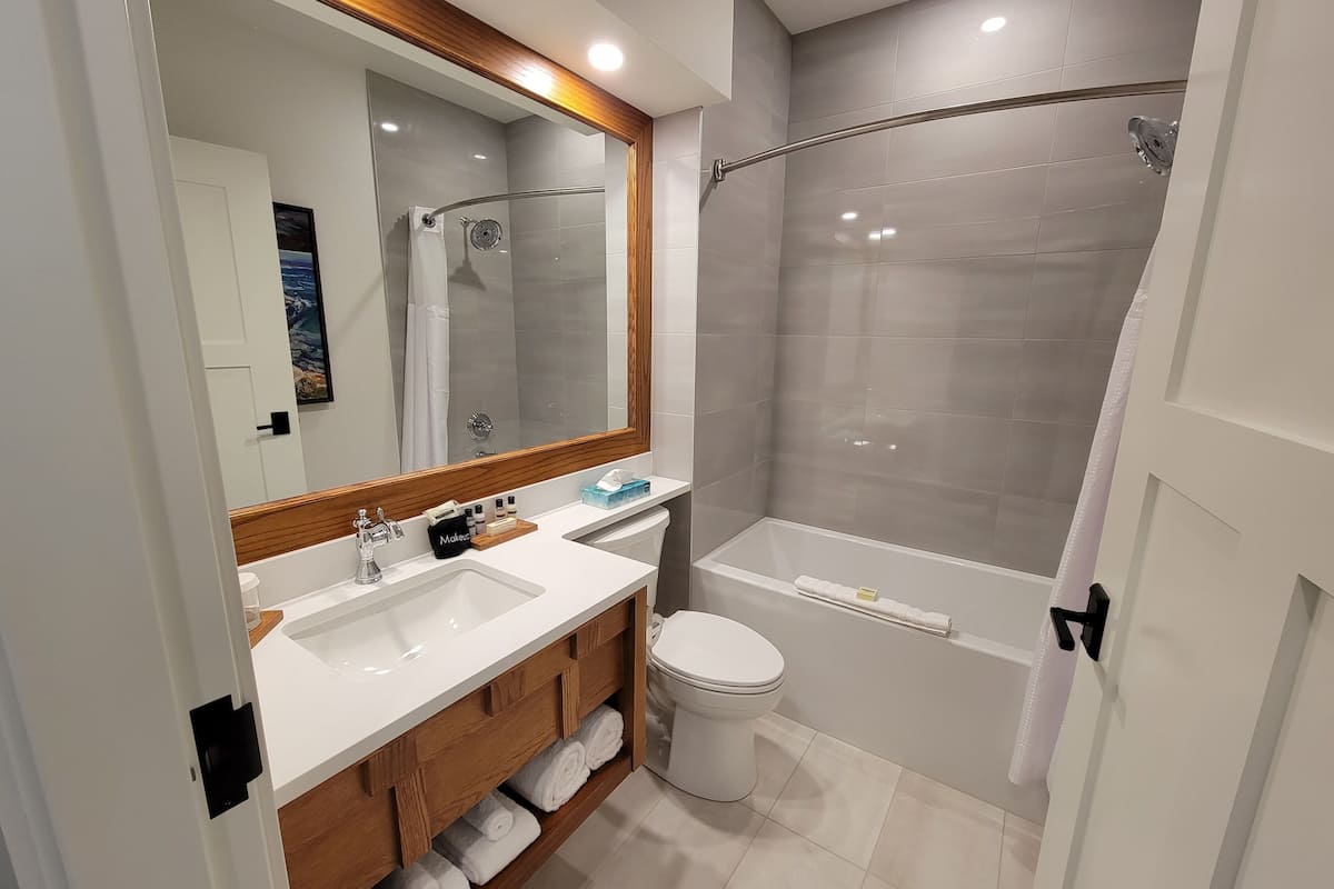 deluxe double room, 2 queen beds, lake view | bathroom | hair dryer, bathrobes, towels