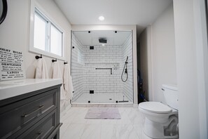 Shower, hair dryer, towels, soap