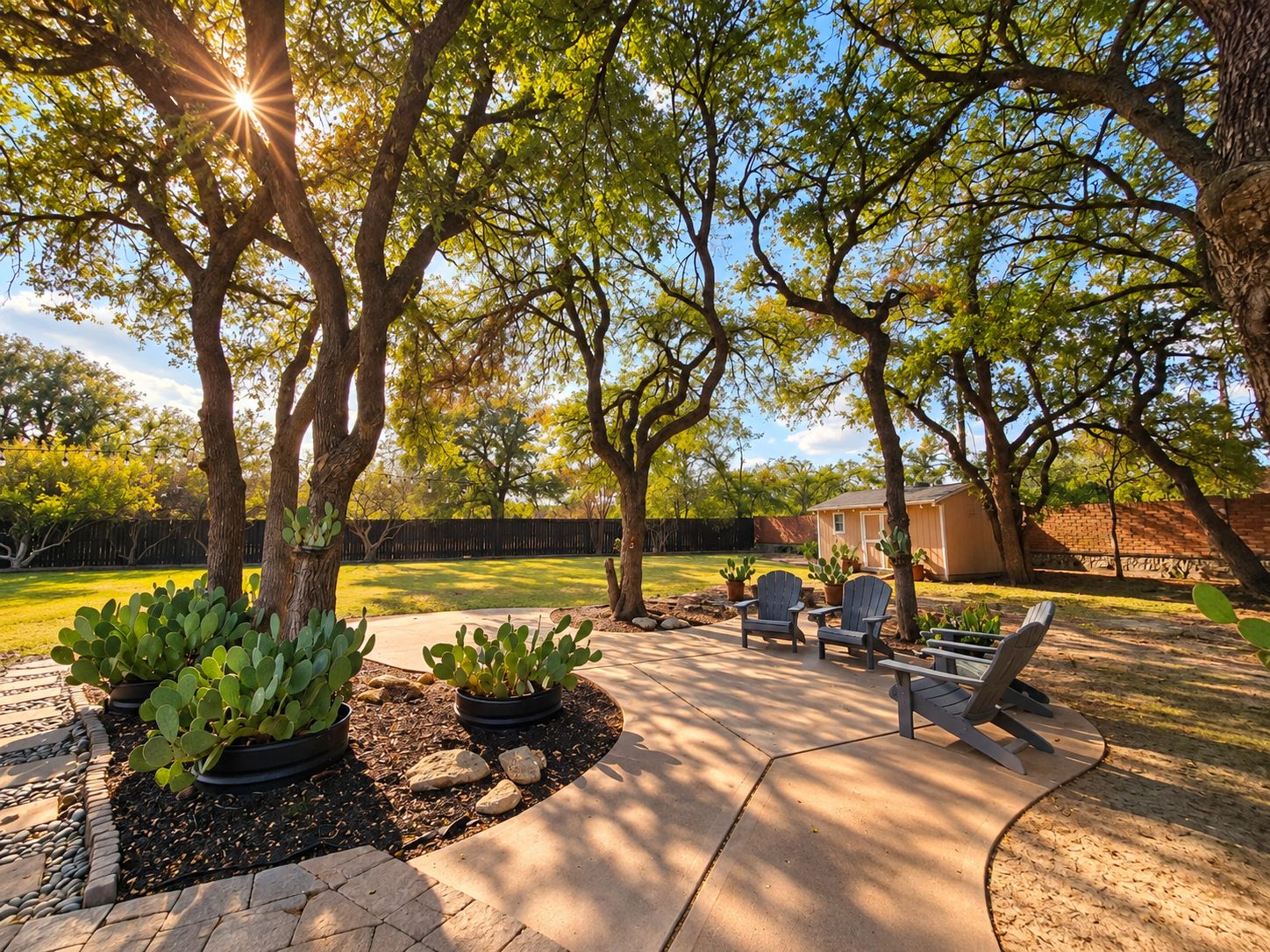 A patio area with outdoor seating and cacti.