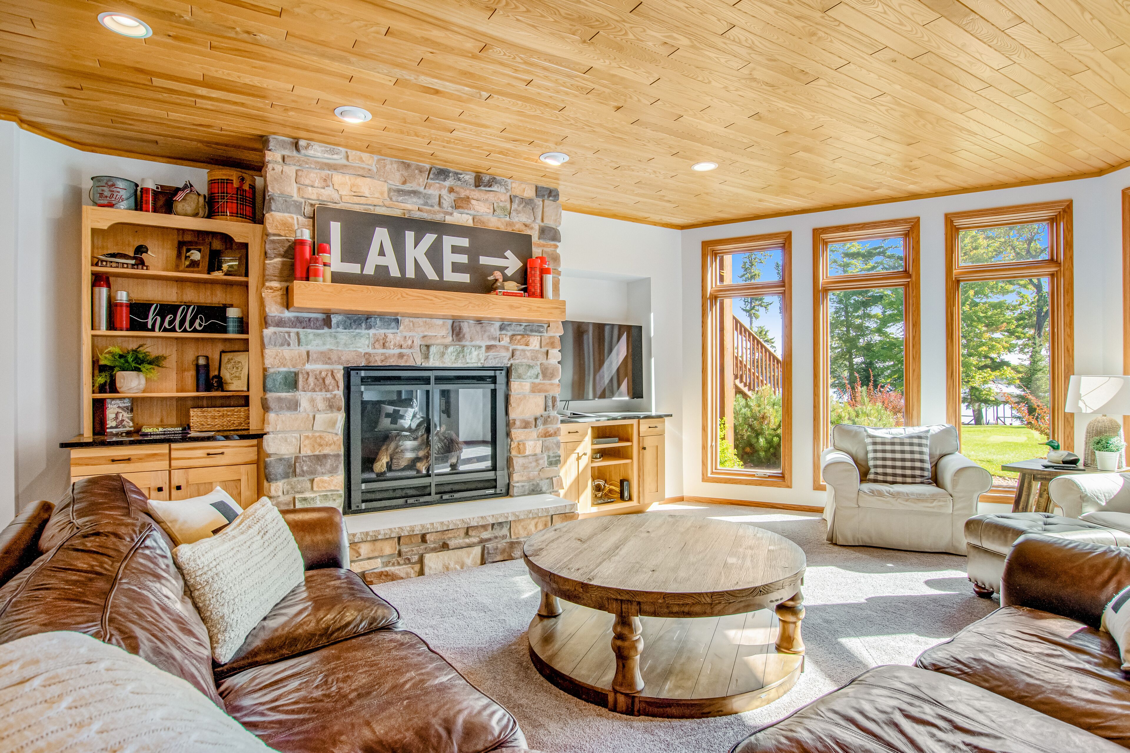 Waterfront condo with lake views, boat slip, grill, beach, AC, fireplace, & WiFi