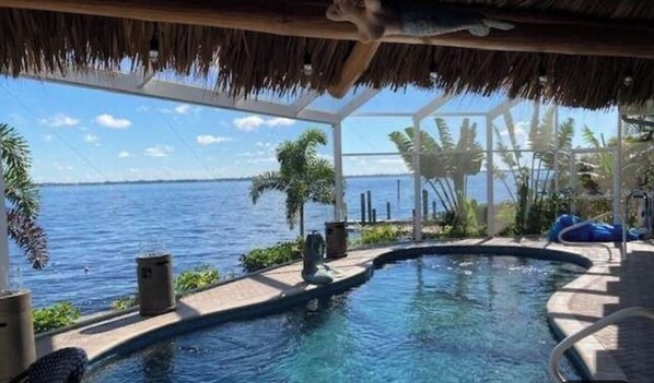 Outdoor pool, a heated pool - Ocean front Home with a beautiful sunset view. (Cape Coral)
