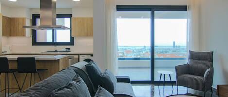 Deluxe Apartment | Living area | 43-inch flat-screen TV with digital channels, TV