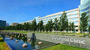 A modern building with a sign reading 'Cleveland Clinic.' - Miracle on 54th - Hot Tub, Sauna, and Pickleball (Cleveland)