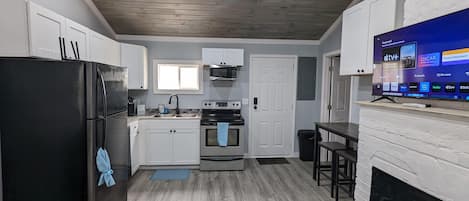 Fridge, microwave, oven, dining tables