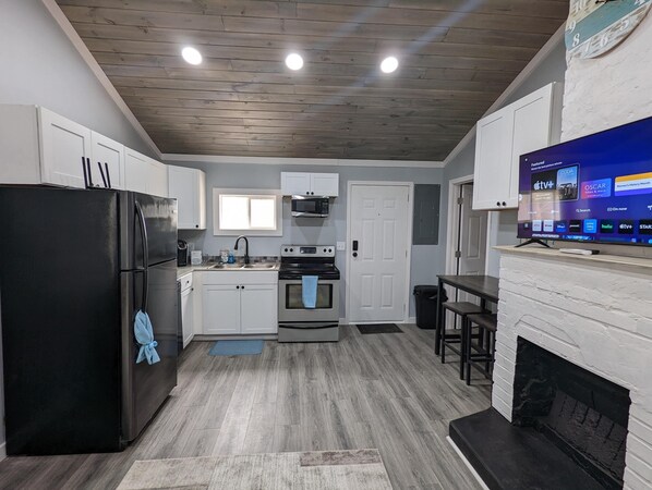 Fridge, microwave, oven, dining tables