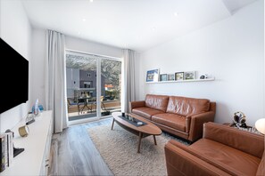Comfort appartement | Woonruimte | Een televisie