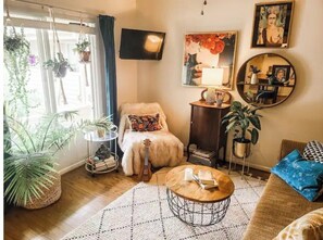 Relax in a welcoming space with a comfortable sofa set, coffee table, and decorative items.
