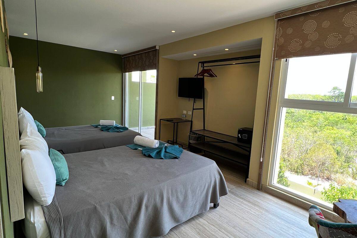 standard quadruple room | 1 bedroom, in-room safe, desk, laptop workspace