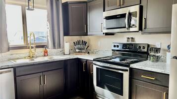 Coffee/tea maker, fridge, microwave, oven