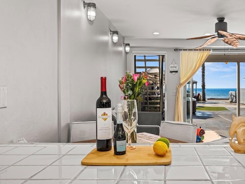 BEACHFRONT COTTAGE LOWER UNT ON THE STRAND IN OCEANSIDE, TWO-BED AND ONE-BATH