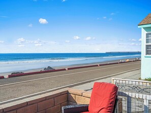 On the beach, sun-loungers, beach towels - BEACHFRONT COTTAGE LOWER UNT ON THE STRAND IN OCEANSIDE, TWO-BED AND ONE-BATH (Oceanside)