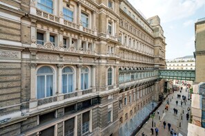 A historic building with multiple floors, large windows, and ornate architectural details. - Large Covent Garden 1BR, Charing Cross/Embankment station, by Blueground (London)