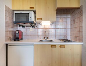 Fridge, toaster, high chair, cookware/dishes/utensils