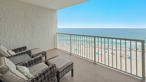 A balcony with wicker furniture, a view of the beach, and a railing. - Summerhouse #1205A- DIRECT BEACH FRONT, RECENTLY RENOVATED, GREAT LOCATION! (Orange Beach)