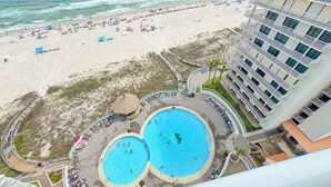 A hotel with a pool area, beach access, and a view of the ocean. - Summerhouse #1205A- DIRECT BEACH FRONT, RECENTLY RENOVATED, GREAT LOCATION! (Orange Beach)
