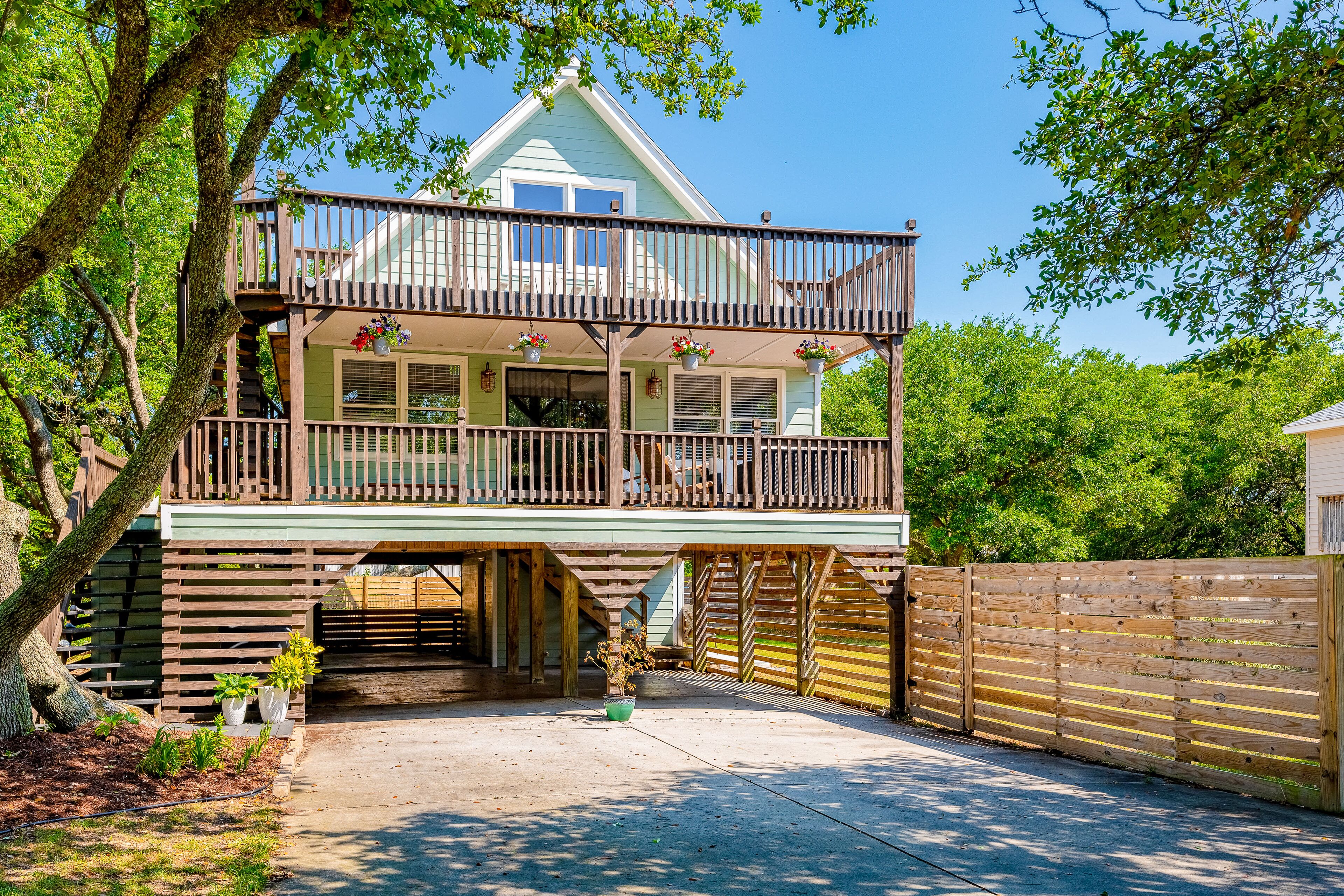 Dog-friendly home with central AC, washer/dryer, WiFi, and yard - near beach