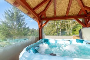 A hot tub under a wooden roof with a view of a forest. - Chalet With Private Whirlpool And Sauna, Zavrh, Croatia (Zavrh)