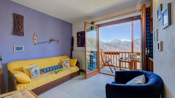 Family Apartment, Multiple Bedrooms (Rebecca's House (few steps from) | Living area | 21-inch TV with cable channels