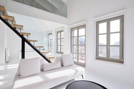 Clock Tower Grand View Suite | Living area | 45-inch LED TV with cable channels, TV, fireplace