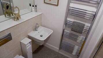 Shower, hair dryer, towels, toilet paper