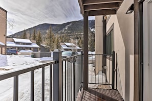 Enjoy breathtaking views of the snowy mountains from this serene balcony.