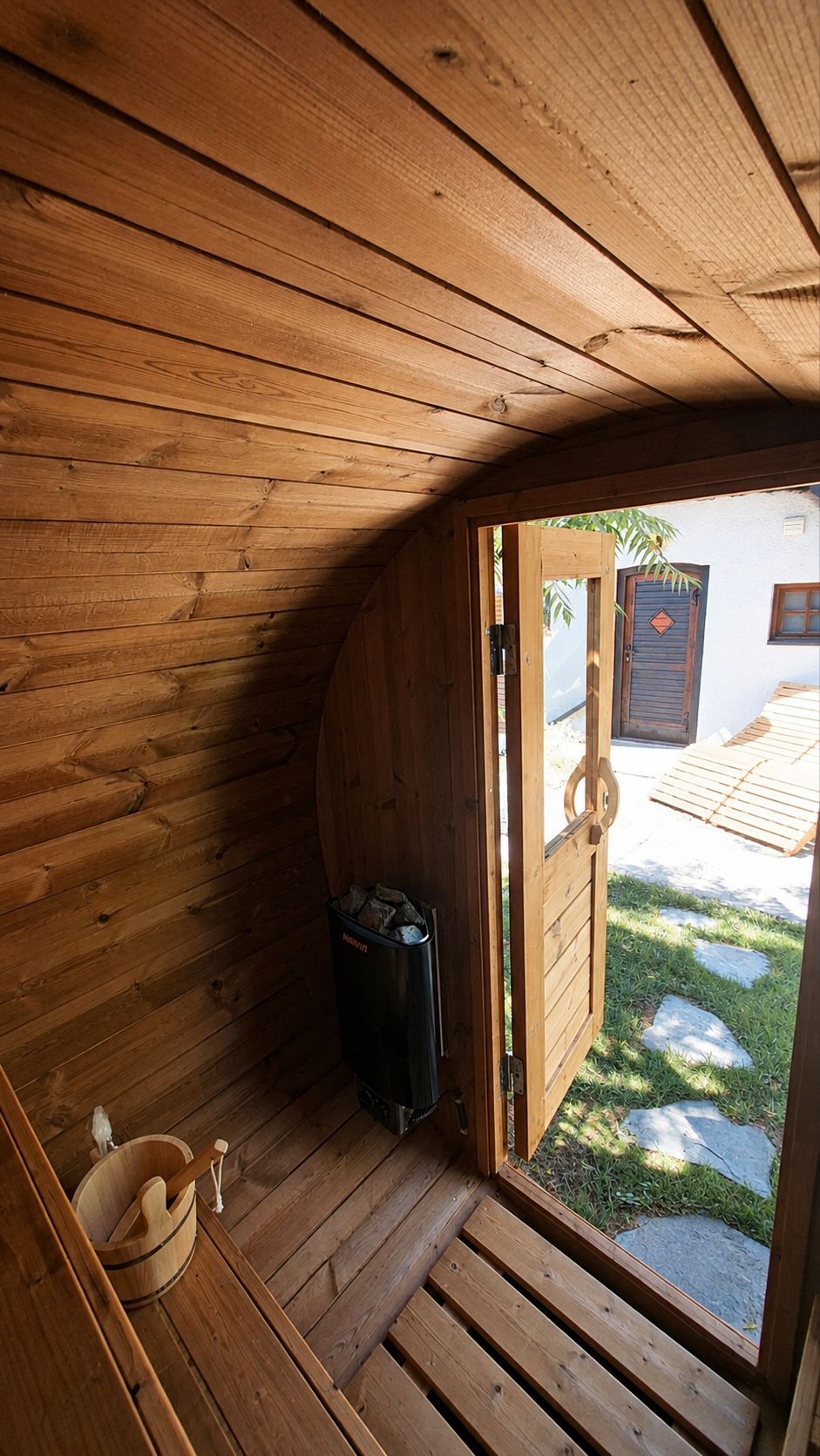 A wooden interior with a door leading to an outdoor area.