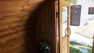 A wooden interior with a door leading to an outdoor area.