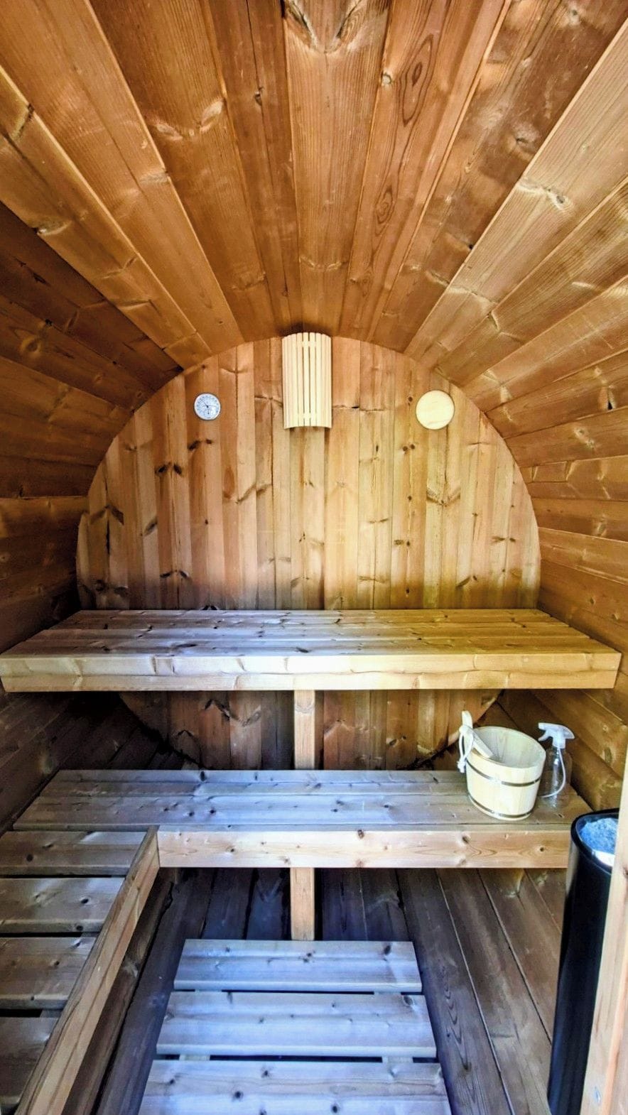 A sauna with wooden walls and benches.