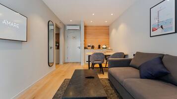 Deluxe Apartment | Living area | 42-inch Smart TV with satellite channels, TV