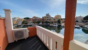 Enjoy breathtaking views of the marina from this balcony.