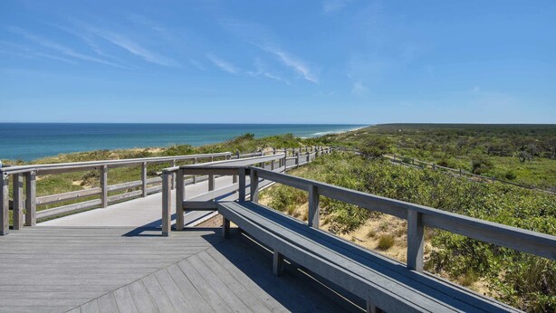 A wooden boardwalk leading to a beach with a clear view of the ocean. - Walk to Restaurants Shopping & Harbor! (Wellfleet)