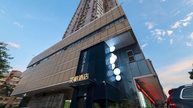 A hotel with a modern design, featuring a prominent sign for the EDGAR HOTEL and a visible entrance. - Shenzhen Aige Hotel (Clothing Wholesale Market Nanyou Metro Station Store) (Shenzhen)