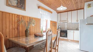 Apartment | Private kitchen | Full-sized fridge, microwave, stovetop, electric kettle