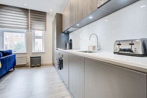 Apartment, 1 Queen Bed | Private kitchen | Fridge, microwave, oven, stovetop